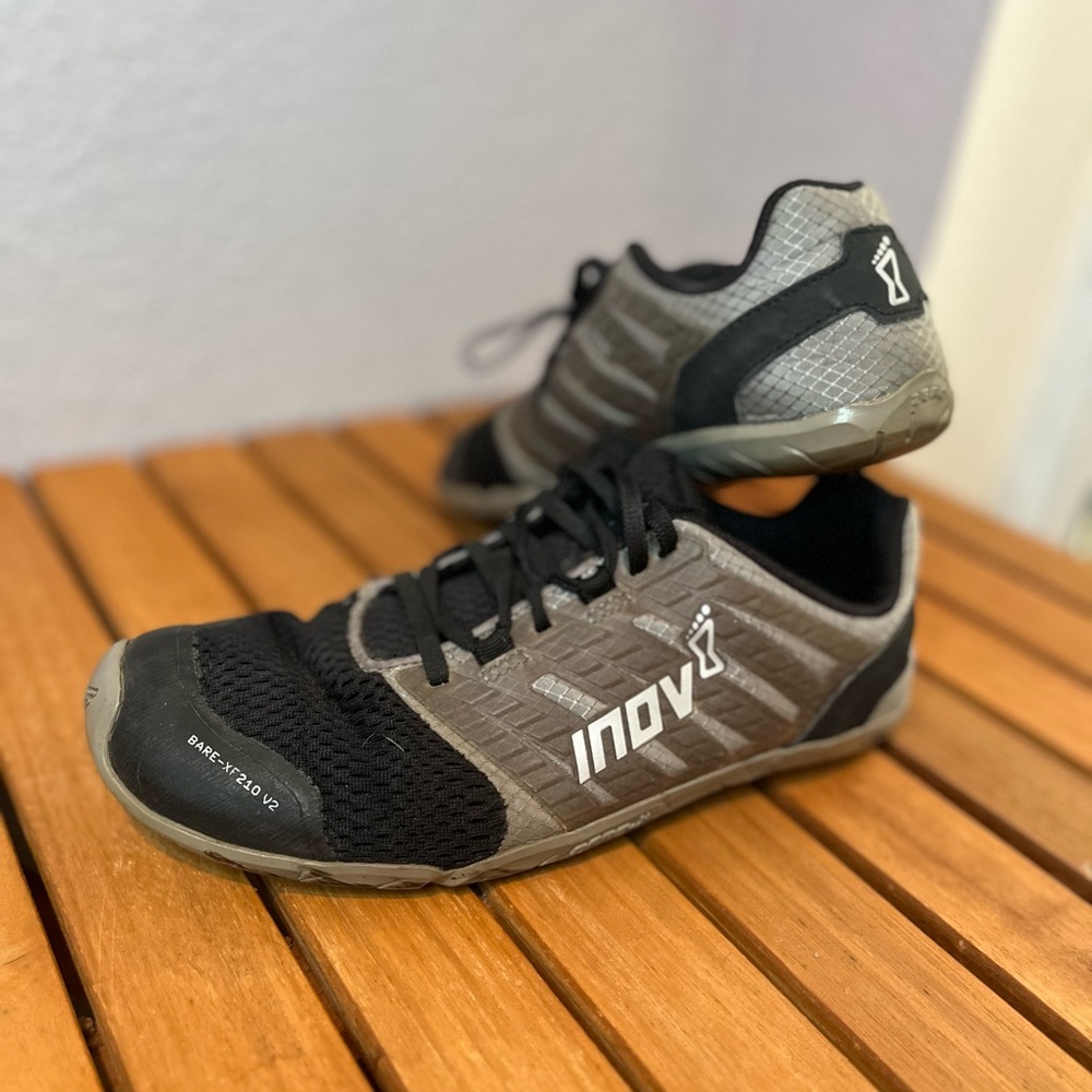 Grey and black Inov8 running shoes. Broken in good. In great condition.